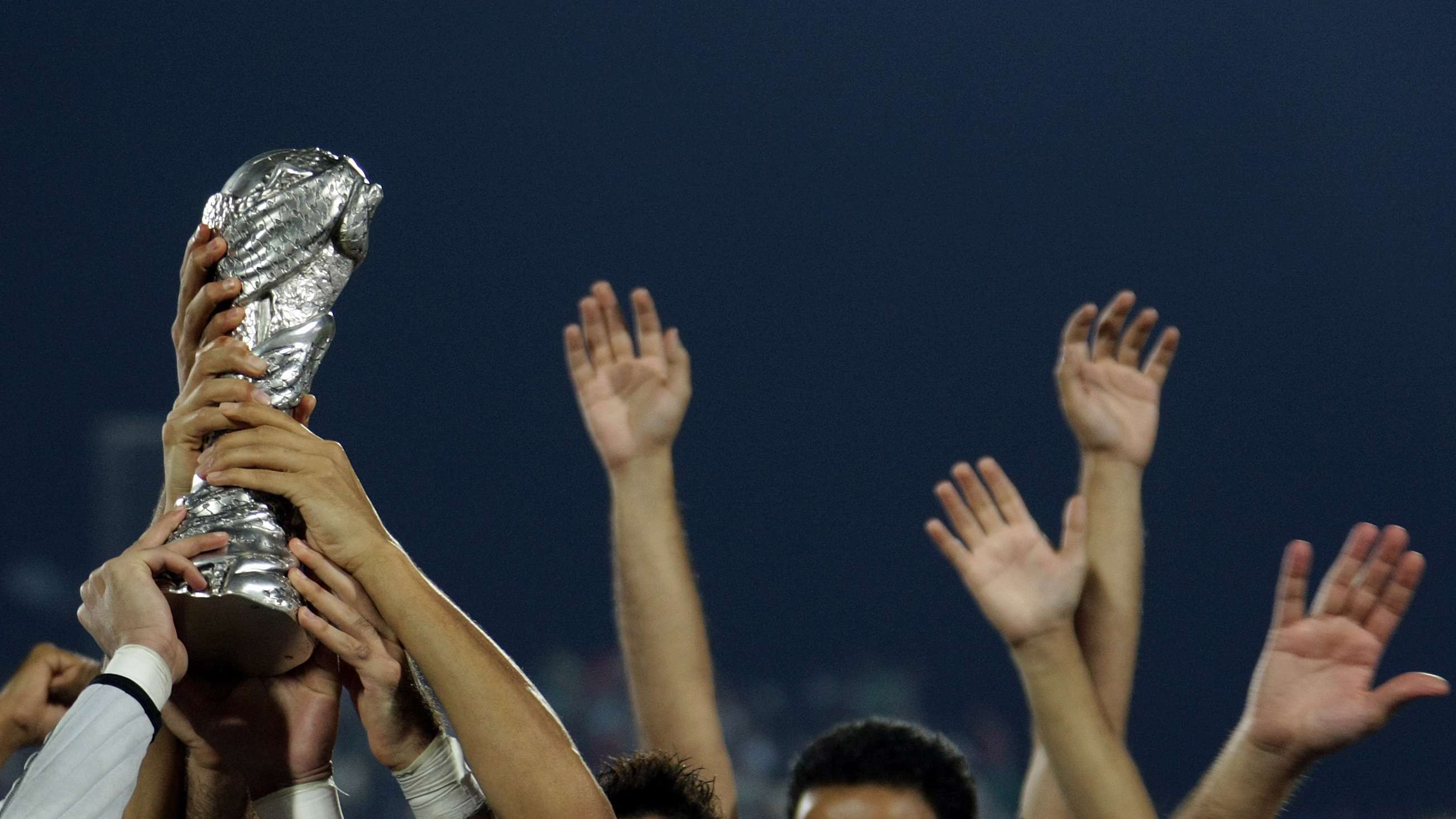 Kuwaiti players hold heir trophy as they